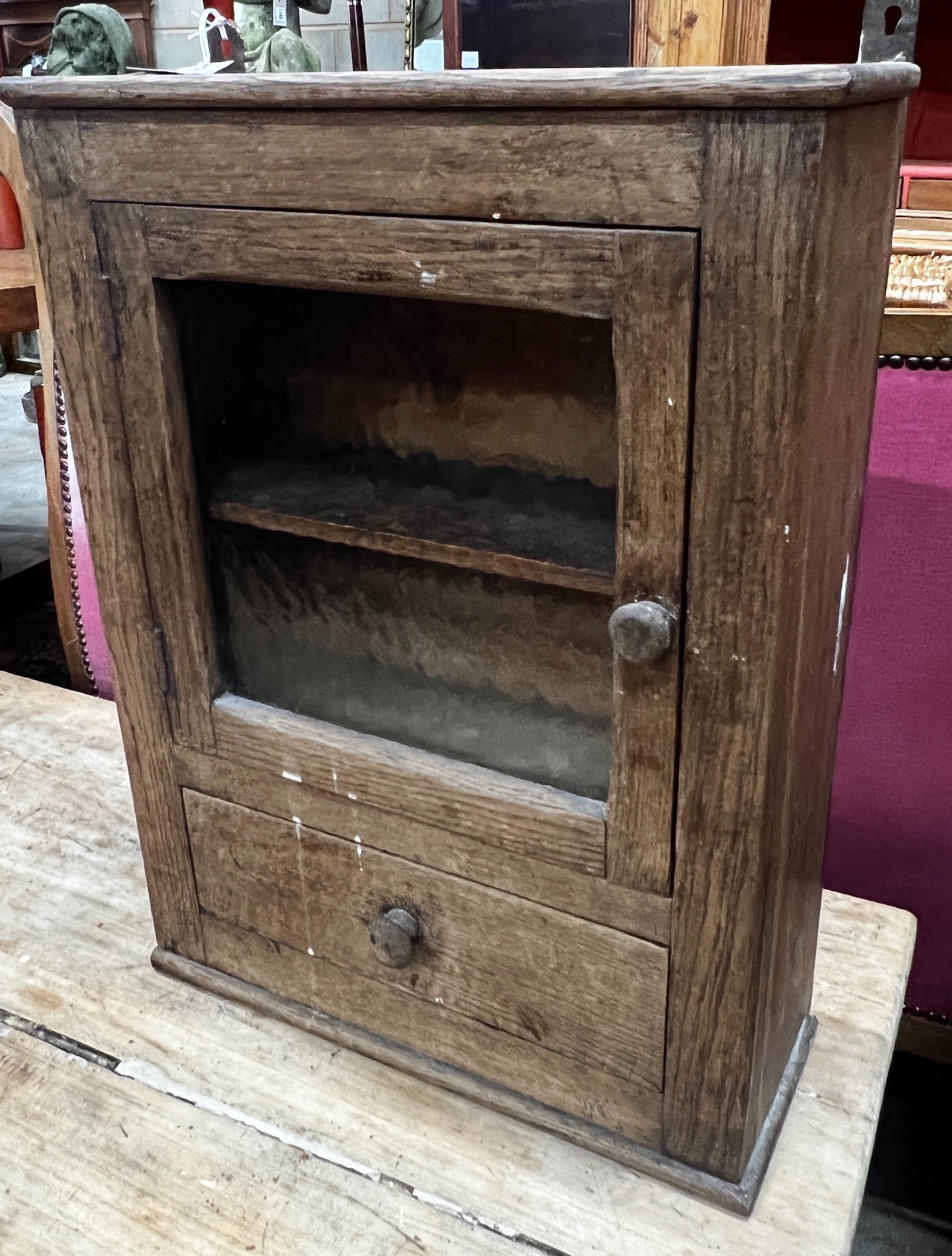 A small provincial glazed oak wall cabinet, width 43cm, depth 16cm, height 56cm